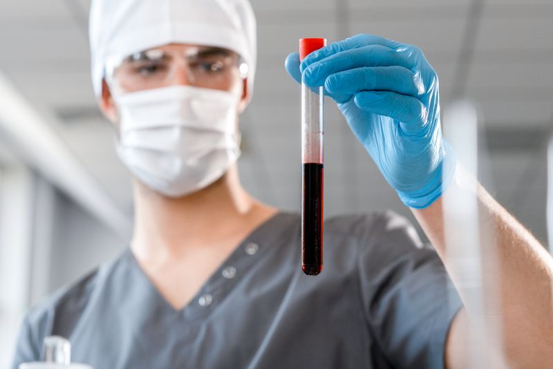 Researcher analysing a sample in a medical laboratory